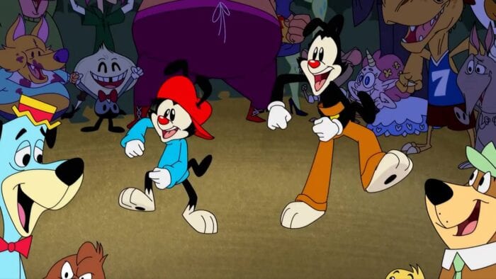 Wakko and Yakko dance in front of Huckleberry Hound and Yogi Bear