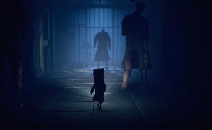 Mono with a torch near some enemies in Little Nightmares 2