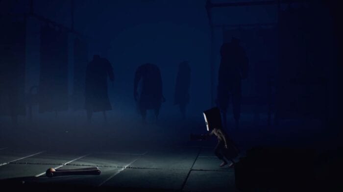 Mono surrounded by shadows in Little Nightmares 2