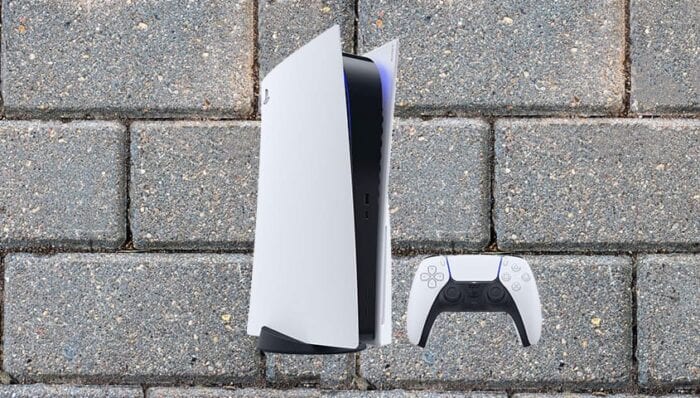PS5 console on a brick background